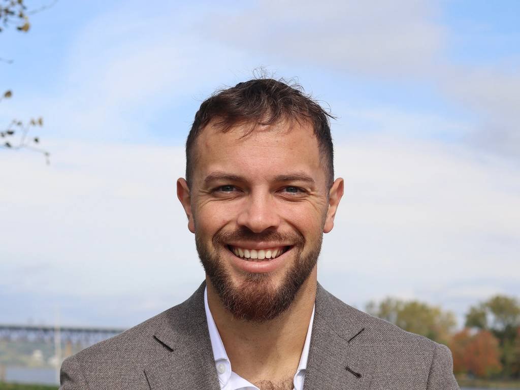 Eric Layden outdoors by the Hudson River