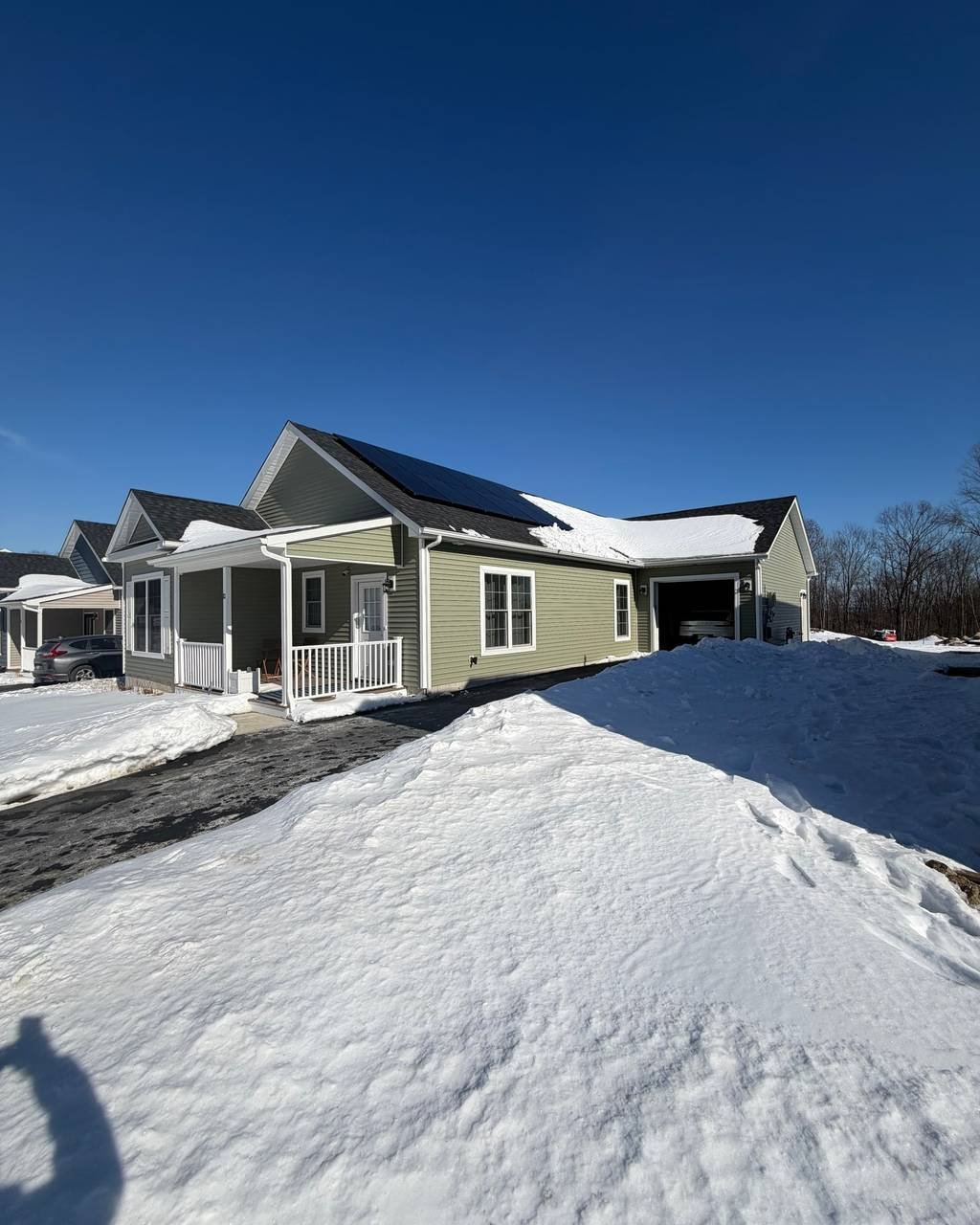 Home with rooftop solar after a fresh snowfall